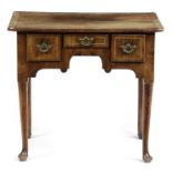 A GEORGE II WALNUT AND OAK LOWBOY C.1730 with cross and feather banding and three frieze drawers