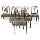 A SET OF SEVEN GEORGE III MAHOGANY DINING CHAIRS IN THE MANNER OF GILLOWS, C.1790-95 each with