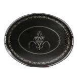 A GEORGE III OVAL TOLE TRAY C.1770 black painted and inlaid with metal decoration, with a central