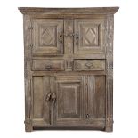 AN OAK LIVERY CUPBOARD 17TH CENTURY with a bog oak and holly chevron band and carved decoration,