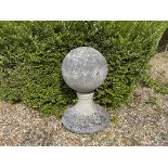 A SET OF FOUR COMPOSITE STONE BALL FINIALS 20TH CENTURY on socle bases (4) 55c high