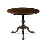 A GEORGE II MAHOGANY TRIPOD OCCASIONAL TABLE MID-18TH CENTURY the circular tilt-top, above a