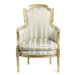 A FRENCH GILTWOOD BERGERE IN LOUIS XVI STYLE 19TH CENTURY with silk upholstery and a leaf moulded