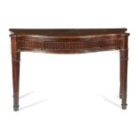 A GEORGE III MAHOGANY SERPENTINE SERVING TABLE C.1790 inlaid with stringing, the fan inlaid top with