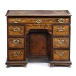 A DIMINUTIVE GEORGE I 'MULBERRY' KNEEHOLE DESK EARLY 18TH CENTURY AND LATER with stained burr
