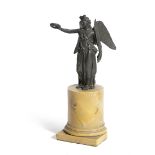 AN ITALIAN BRONZE GRAND TOUR FIGURE OF VICTORY EARLY 19TH CENTURY mounted on a giallo antico