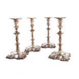 A set of four George II cast silver candlesticks, by John Cafe, London 1752, knopped columns,