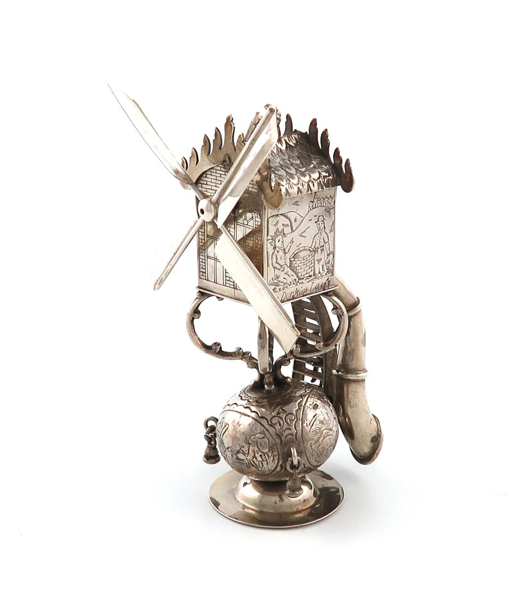 A late 19th century Dutch silver windmill, 1892, with engraved figural scenes and with inscriptions,