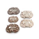 A collection of five early 19th century silver wine labels, shaped oval form, with shell scroll