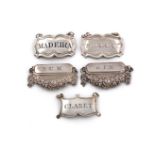 A collection of five antique silver wine labels, comprising: a pair by Francis Clark, Birmingham