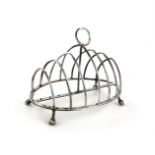 A George III silver seven-bar toast rack, maker's mark partially worn, W?, London 1789, oval form,