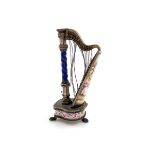 A late 19th century Austro-Hungarian silver-gilt and enamel novelty harp vinaigrette / pot pourri