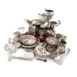 A mixed lot of silver items, various dates and makers, comprising: a tea pot stand, wooden