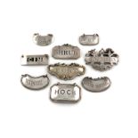 A collection of silver wine labels, various dates and makers, comprising a pierced on incised '