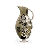 A German silver-overlay glass jug, by Friedrich Deusch, circa 1950, baluster form, scroll handle,