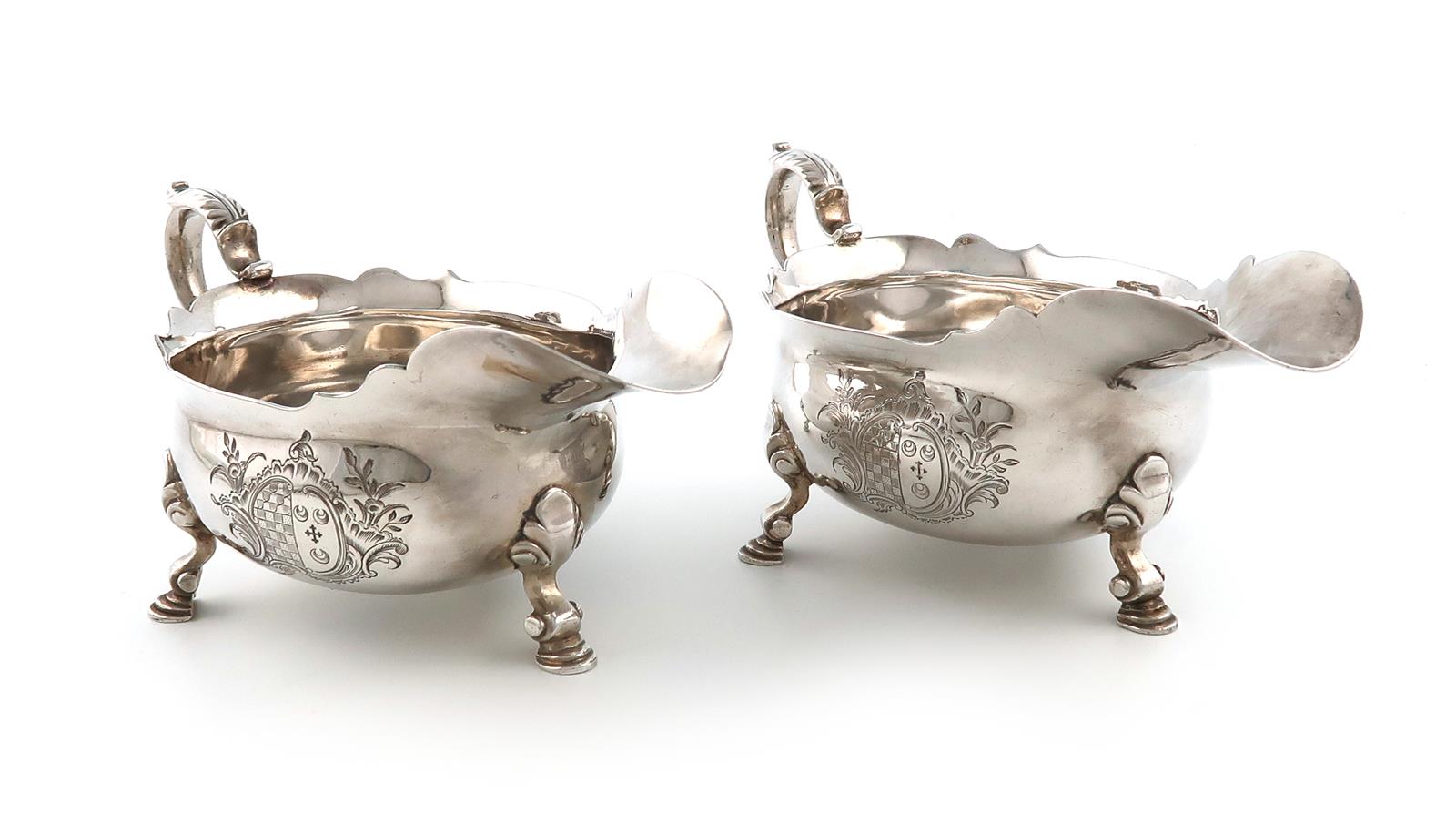 A pair of George II silver sauce boats, maker's mark of IV crowned, unidentified, London 1738,