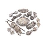 A collection of continental silver belt buckles and cloak clasps, French, Dutch and German,