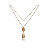 A tassel necklace, the box link chain culminating in a shell motif set with a simulated pearl,