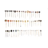 λ A group of 56 stick pins, late 19th/early 20th century, comprising: two set with moonstones; three