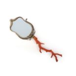 λ A coral and gilt metal hand mirror, 19th century, possibly Italian, the mirror framed in gilt