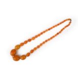 A single row amber bead necklace, 72cm, 85g.