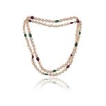 A single-row cultured pearl necklace, set with emerald and ruby beads, 106cm long