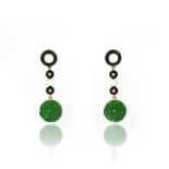 A pair of jadeite, onyx and enamel earrings, designed in the Art Deco style, composed of onyx and