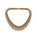 A gold necklace, Italy, 1960s, the gate links culminating in a graduated fringe, length 440mm,