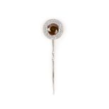 A brown and white diamond stick pin, the top set with a brilliant-cut brown diamond weighing