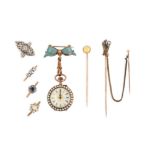 A group of jewellery, comprising: three stick pins, one set with a cabochon opal, one designed as