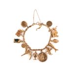 A gold charm bracelet, mid-20th century, the fancy link bracelet suspending 15 gold charms, the