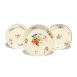 Three Swansea plates c.1815-17, painted probably by Henry Morris, one with a large central floral