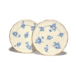 A pair of Nantgarw dessert plates c.1818-20, painted in London with sprays of flowers in dry blue,