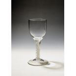 A large wine glass or goblet c.1765, the rounded bowl raised on a double series opaque twist stem,