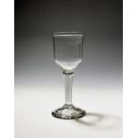 A large wine glass or goblet c.1750, the ogee bowl raised on a thick multi series airtwist stem,