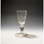 A large Dutch wine glass or goblet mid 18th century, the flared bucket bowl engraved with panels