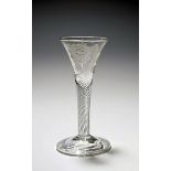 A small Jacobite wine glass c.1750, the drawn trumpet bowl engraved with a rose and bud spray, an