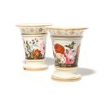 A pair of English porcelain spill vases c.1815-20, painted with continuous bands of flowers