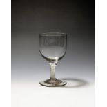 A wine goblet c.1760-70, the wide rounded bowl raised on a double series opaque twist stem above a