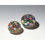 Two Clichy spaced paperweights c.1850, the smaller set with 19 varying canes, the larger with 37