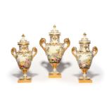 A garniture of three Paris porcelain vases and covers 19th century, each finely painted with flowers