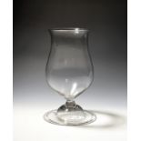 A ceremonial goblet or mixing glass c.1750, the generous bowl of baluster form and raised on a short