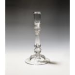 A rare composite stem glass candlestick c.1740, the deep sconce set into a waisted annulated knop
