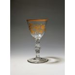 A large wine glass or goblet c.1770, gilded in the London atelier of James Giles with a spray of