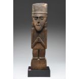 A Chimu marker figure Peru, circa 1100 - 1470 AD standing wearing a head band and loin cloth, both