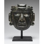 A Mezcala mask Mexico, circa 700 BC - 300 AD green serpentine, with parted lips showing the upper