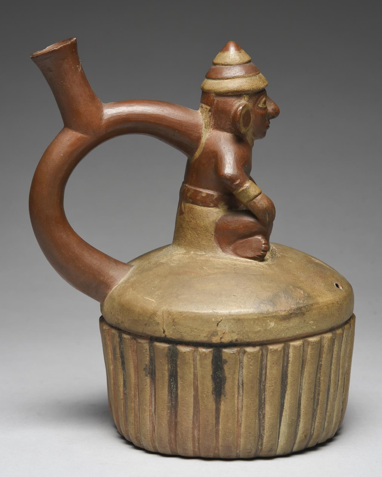 A Moche stirrup spout vessel Peru, circa 400 - 700 AD of circular ribbed form with a domed top - Image 3 of 5