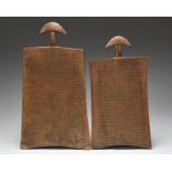 Two Hausa writing boards Nigeria with crescent shaped handles, one with a pierced stem and both with