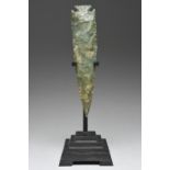 An Aztec eccentric flint Mexico, circa 1300 - 1521 AD greenstone, as a blade, 22.5cm long, on a