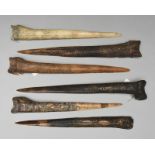 Six Abelam daggers Papua New Guinea cassowary bone, with carved stylised decoration including two